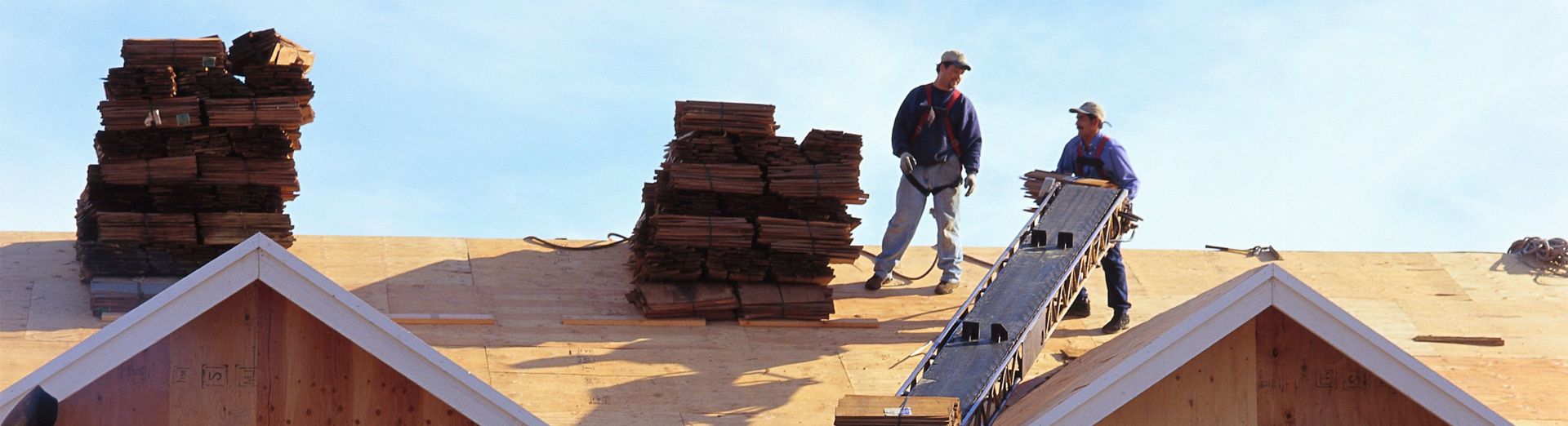 Construction workers working on a house