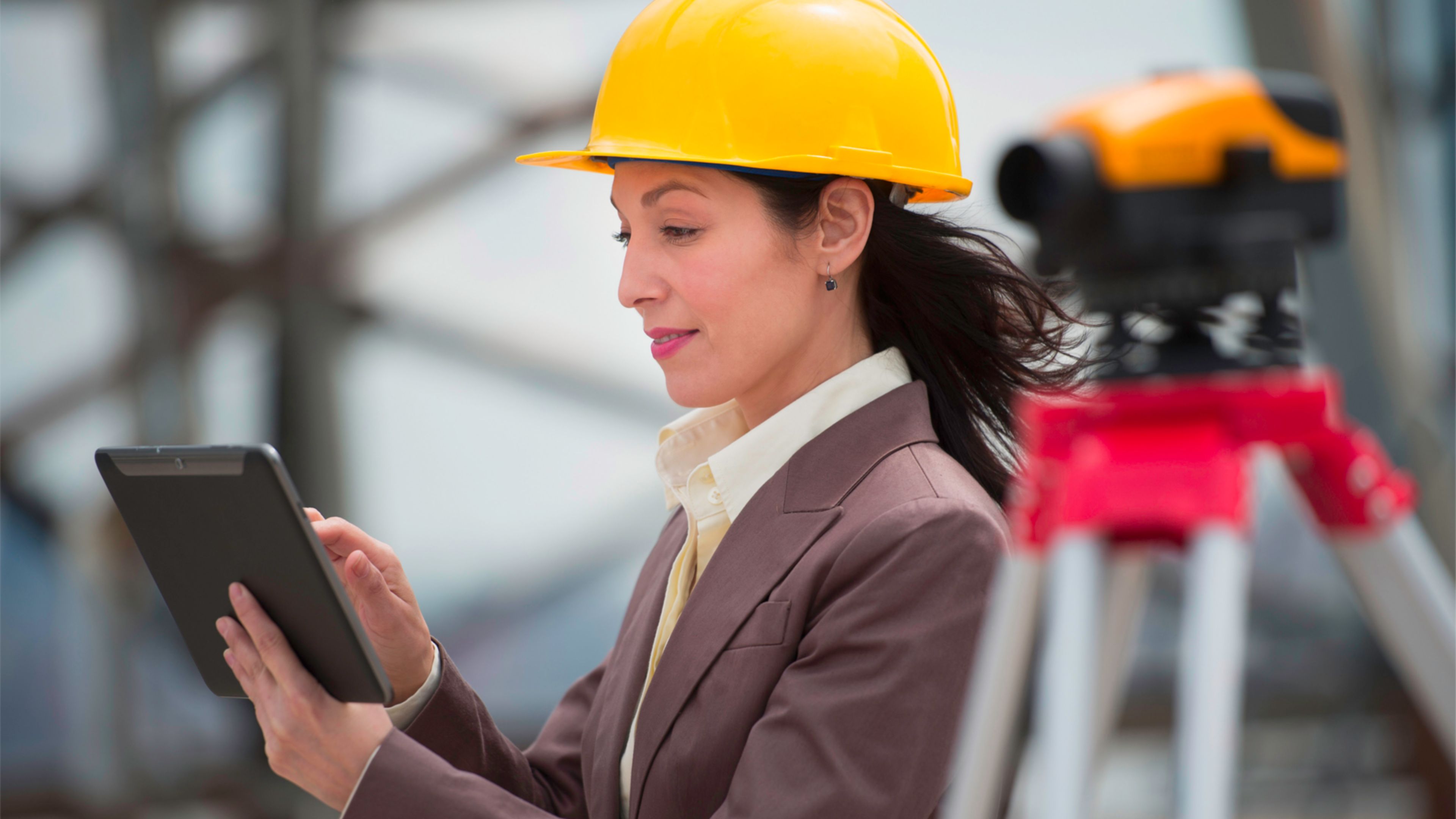 A woman performing predictive maintenance managed with EAM software capabilities