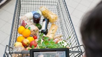 Person using mobile device to help them shop in store