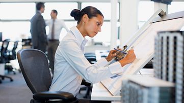 employee drawing on a whiteboard