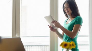 Woman holding digital tablet