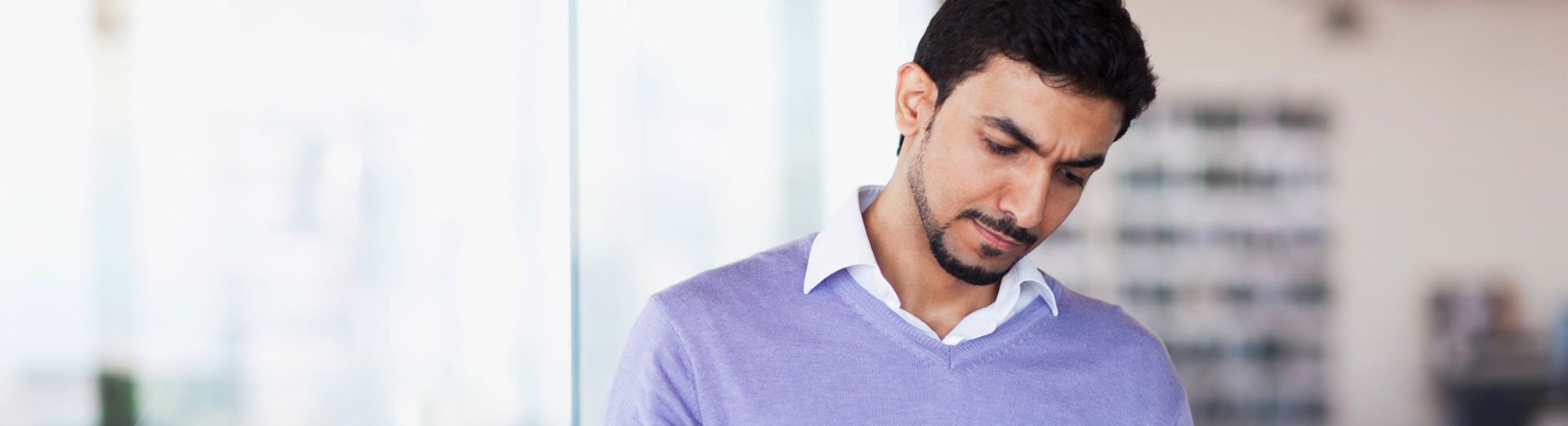 Man reviewing insurance options on a tablet