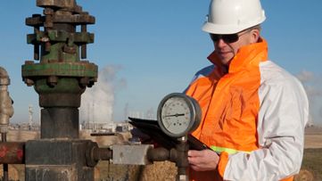 man checking a pipeline