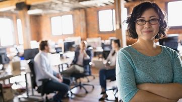 Businesswoman with arms crossed in office