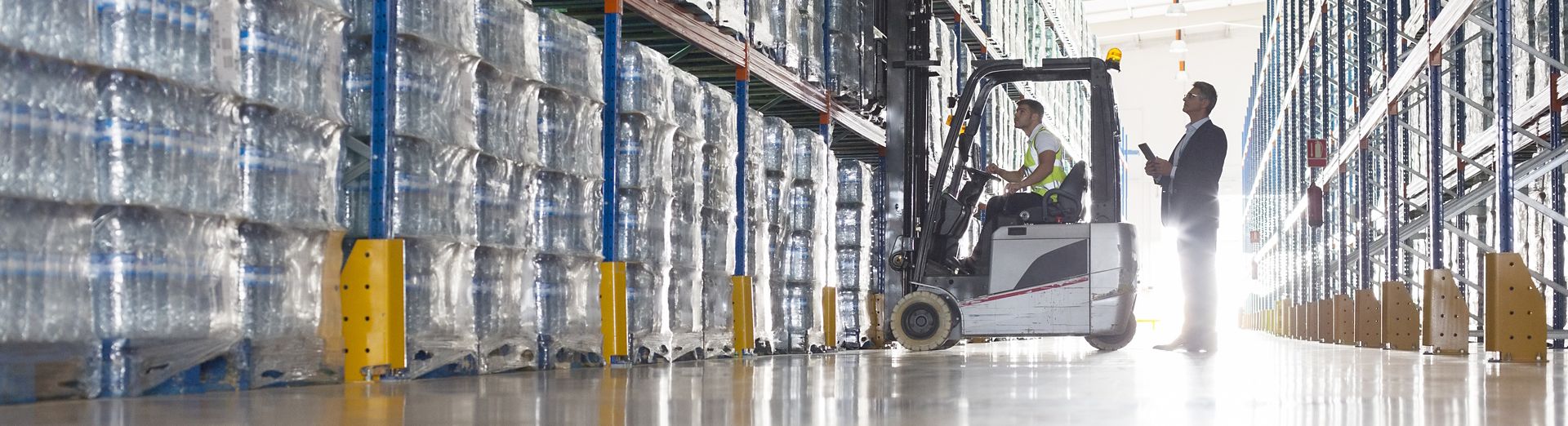 Man using mobile applications from SAP in a warehouse