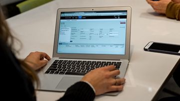 Person using laptop to streamline invoice processing