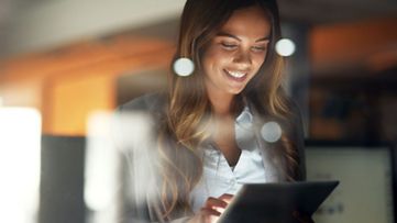 Smiling SAP build partner using a digital tablet 