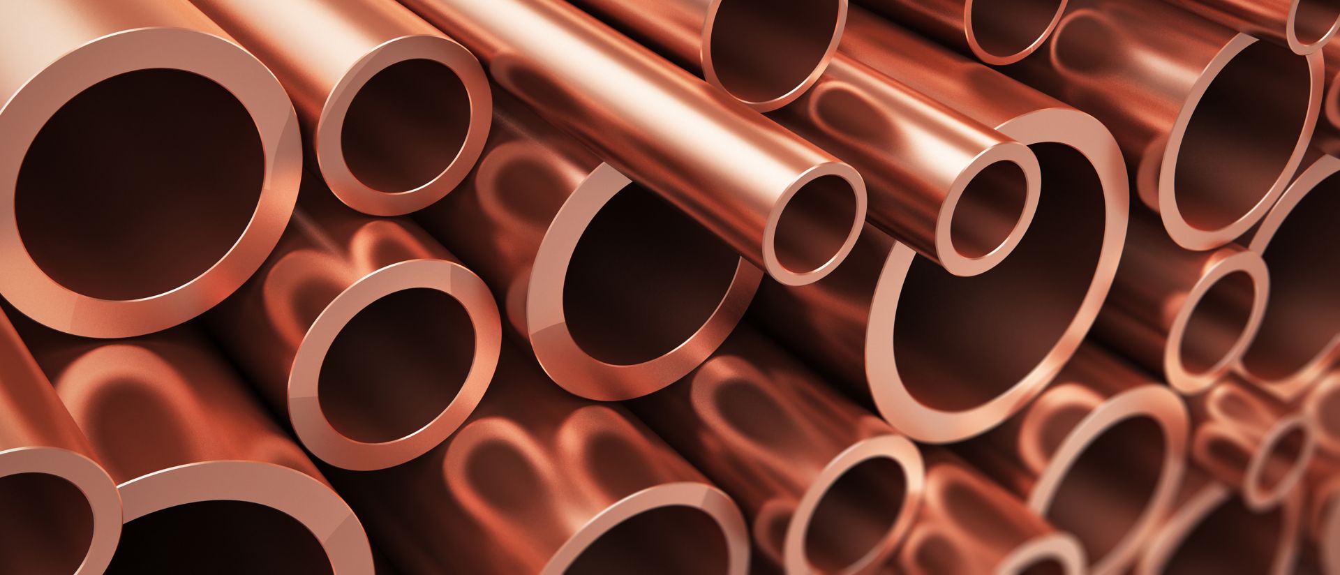 Image of a stack of copper metal pipes 