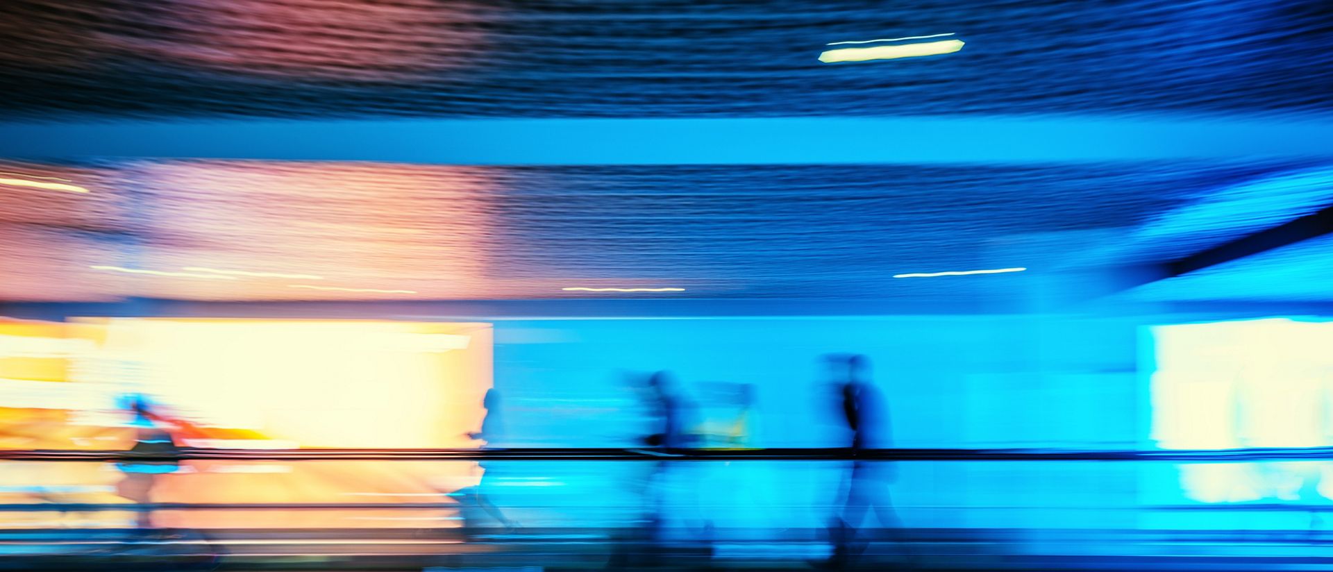 Motion blurred abstract people walking to the airport terminal