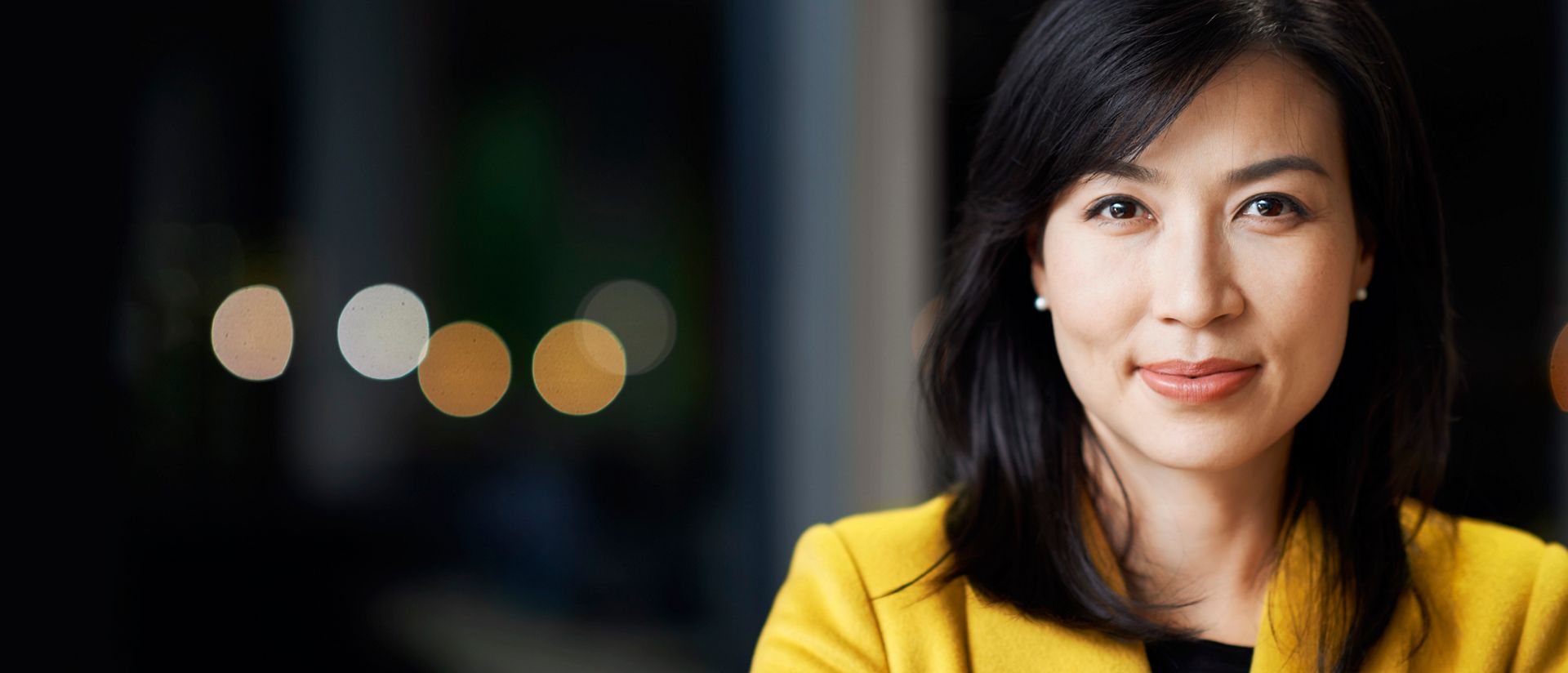 Portrait of an Asian businesswoman at office at night