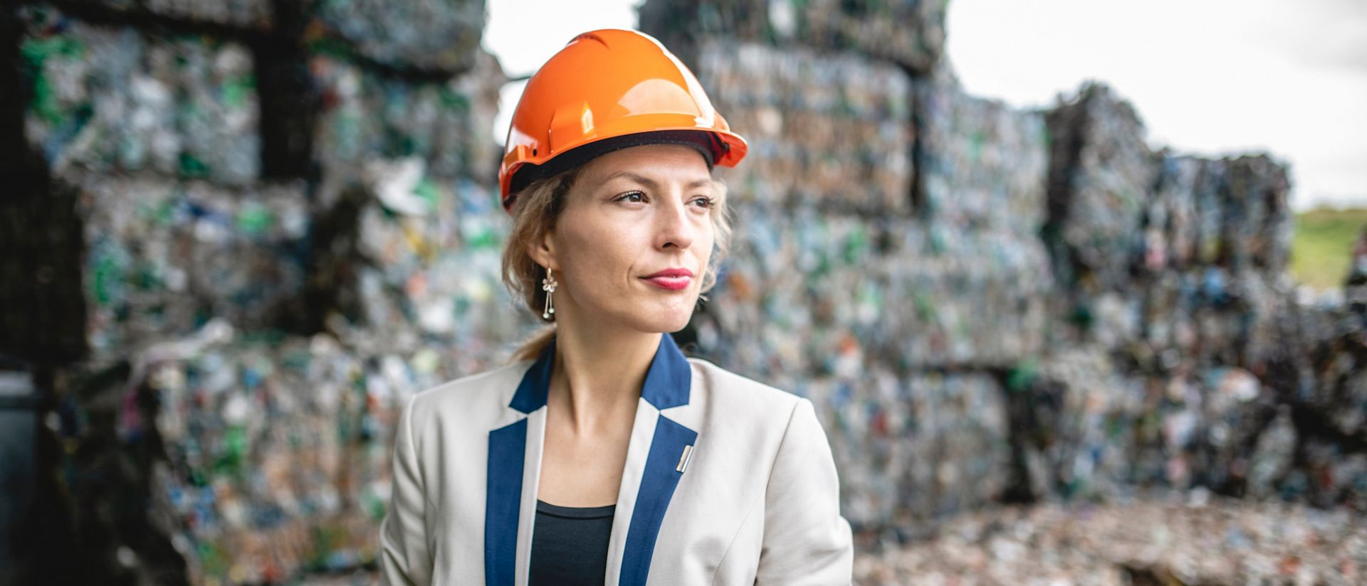 Female Recycling Specialist Conducting Onsite Inspection