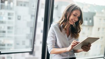 woman looking at tab