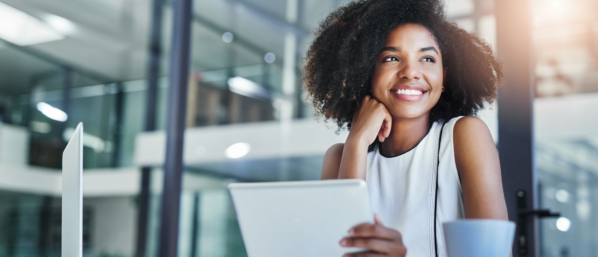 Image of young businesswoman working in an office