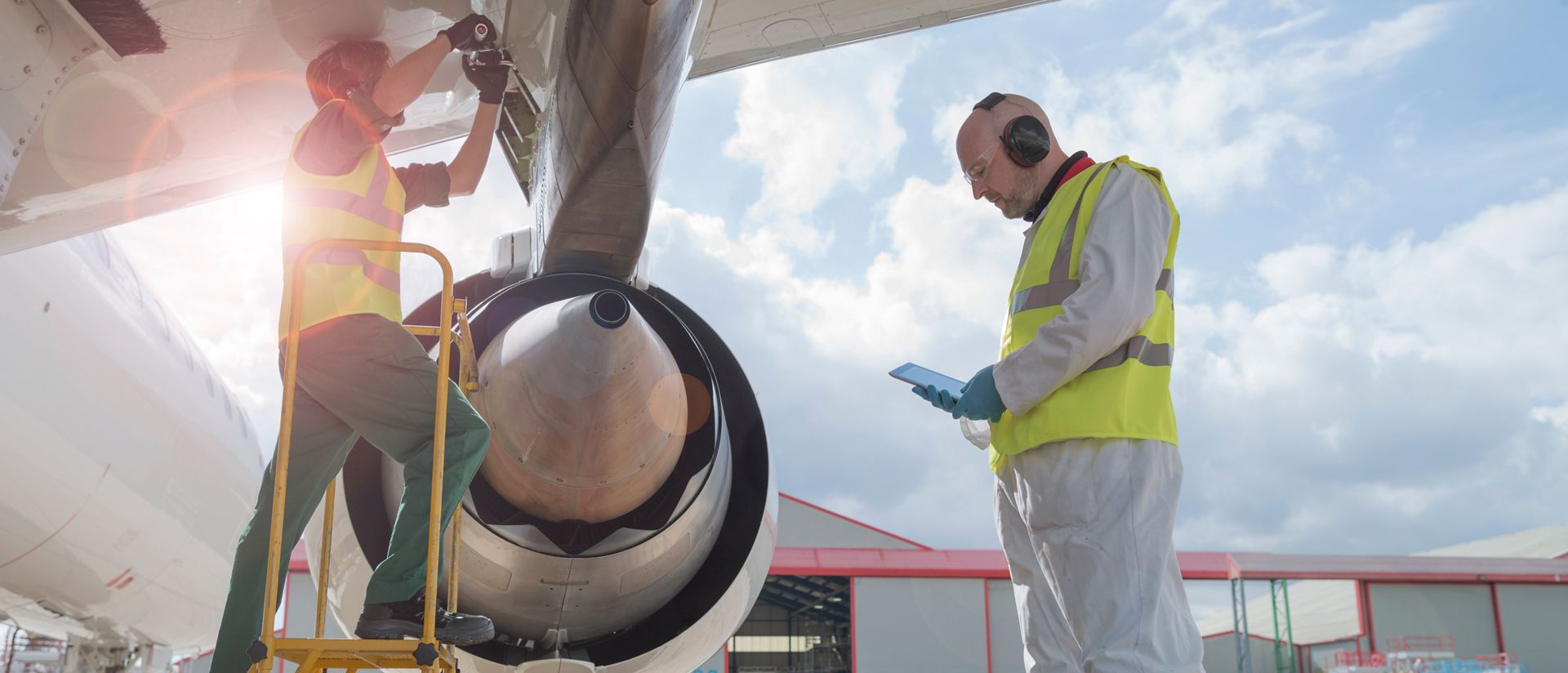 Men working on airplane wing