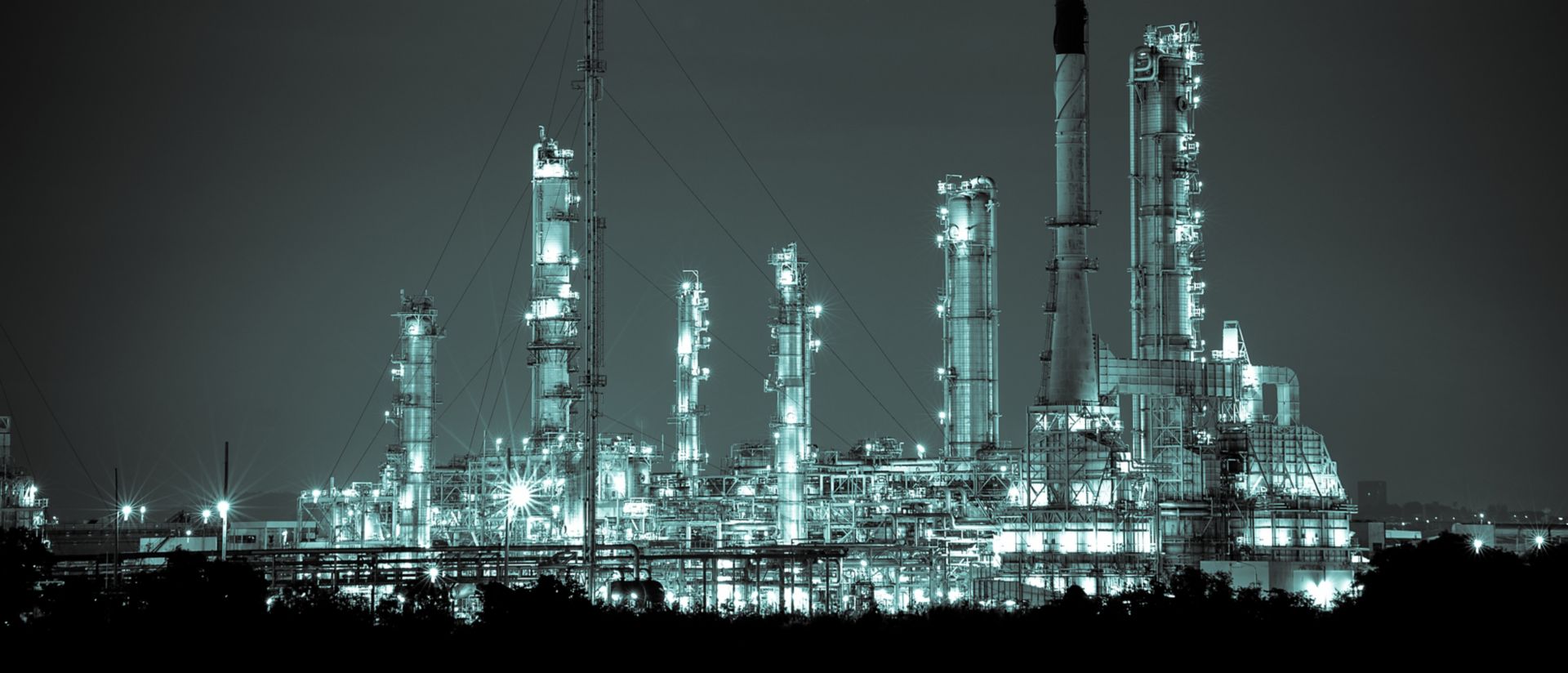 Oil refinery, chemical and petrochemical plant abstract at night