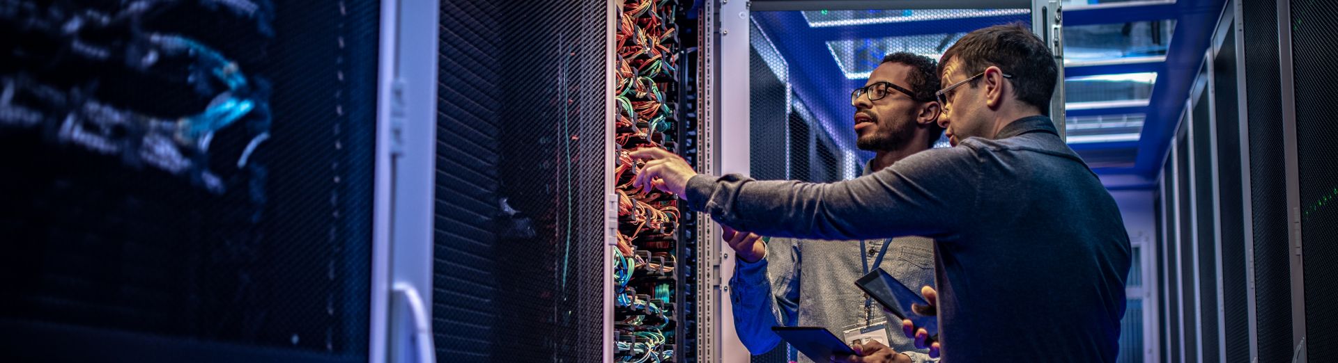IT engineers checking servers for a high tech company