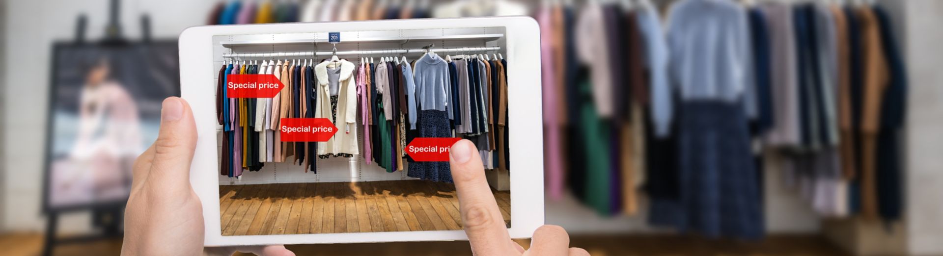 electronic tablet using smart technology to scan and analyse a rail of clothes using SAP cloud software and AI