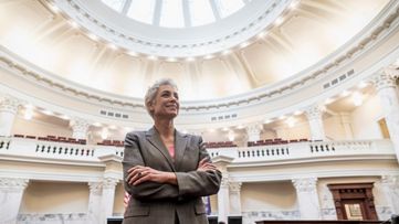 A woman in a government chamber