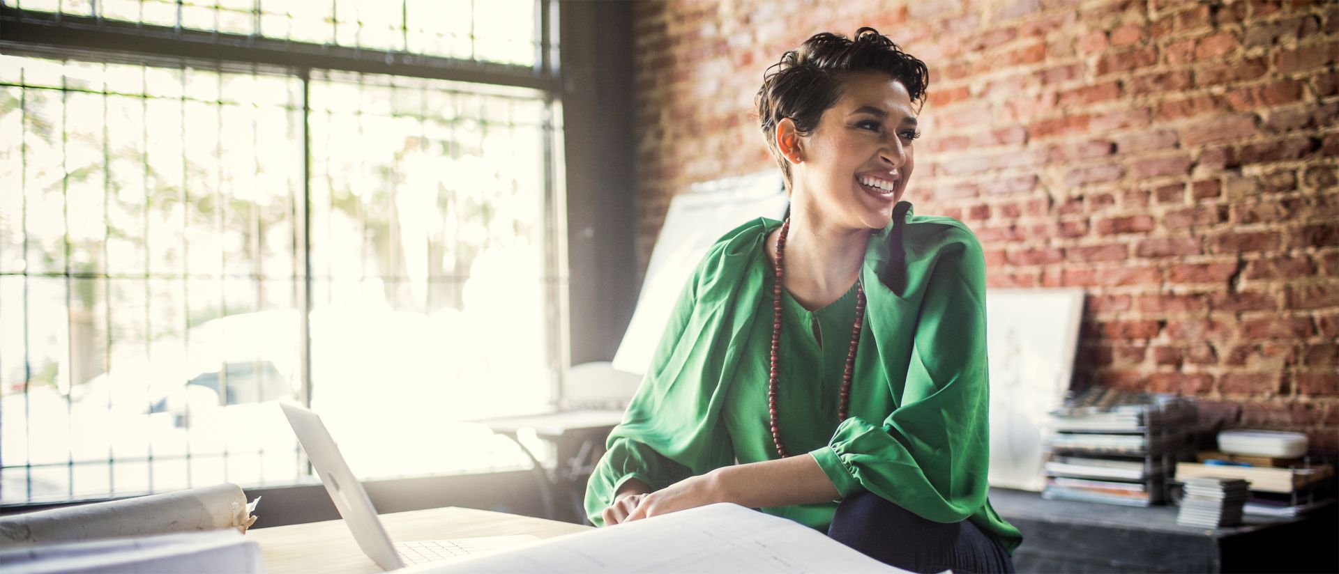 Woman using external workforce and services procurement software on her laptop