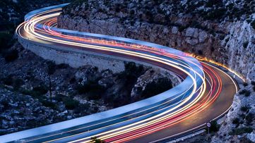 Roads and lights through a mountain pass