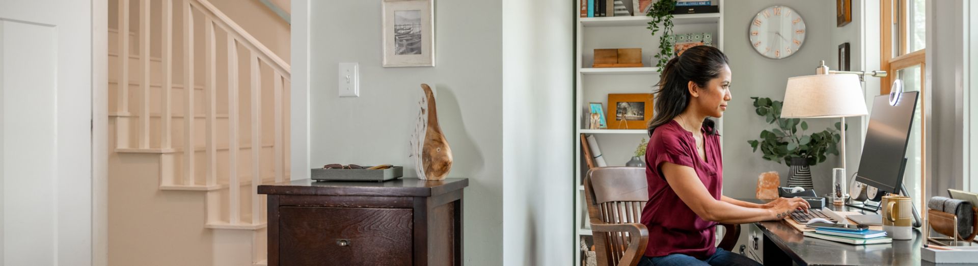 Woman working at desk from home office