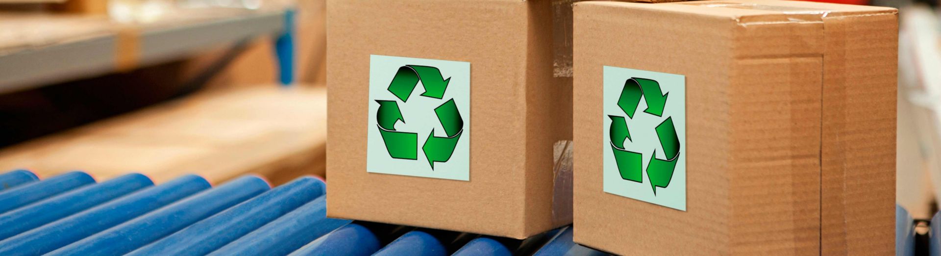 Sustainable logistics, Cardboard boxes with recycling symbols on conveyor belt