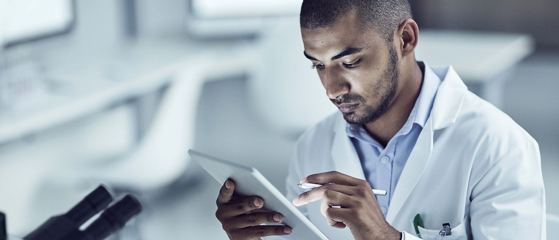 Scientist working with tablet in laboratory