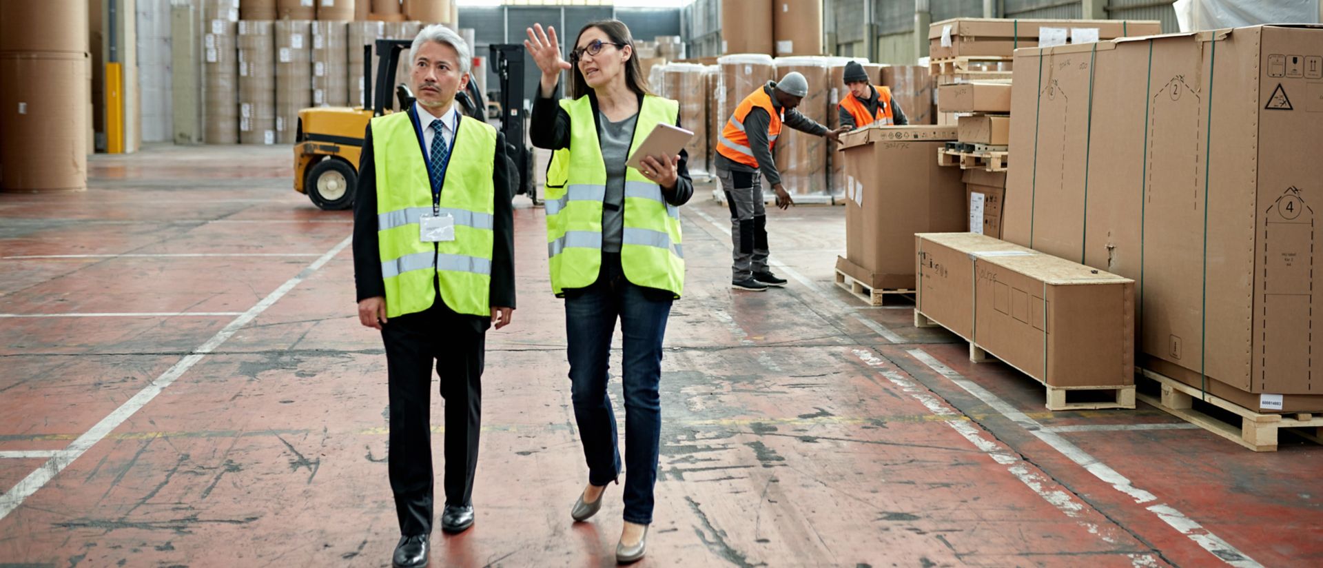 Managers inspecting distribution warehouse