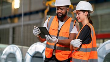 Two people with orange vests