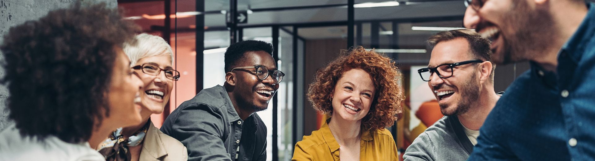 Diverse team of united coworkers with hands together