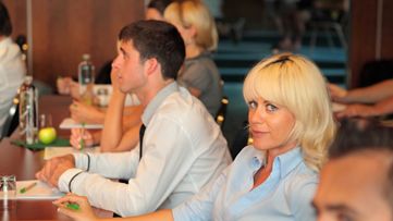 Three people walking down stairs