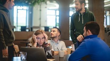 Coworkers walking and talking in the city