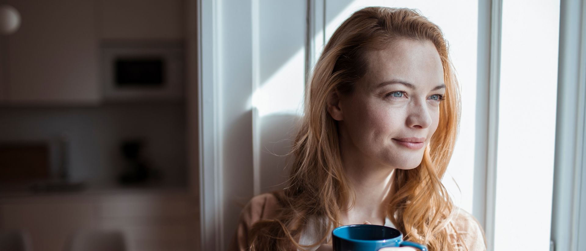 Young woman having a cup of coffee