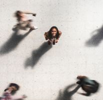  Portrait of happy young woman looking up, top view