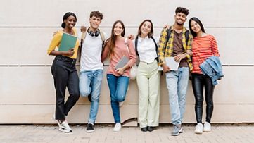 SAP Academic Alliances participants stand together in a group shot against a wall 