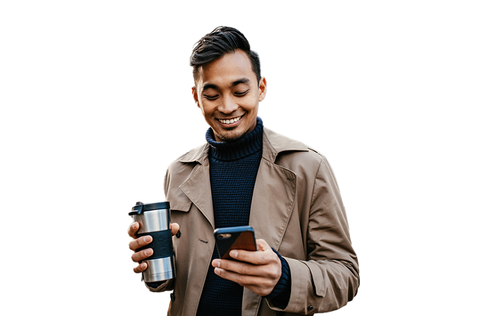 Man holding coffee and reading his phone