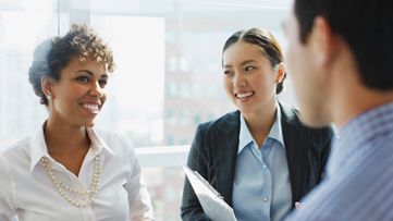 Collegues meeting new employee
