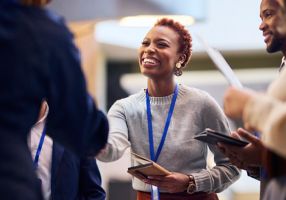 Woman shaking the hand of a man