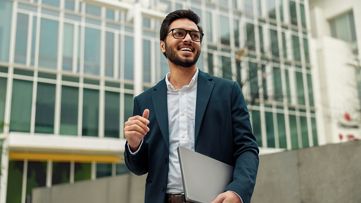 Image of a developer holding a laptop