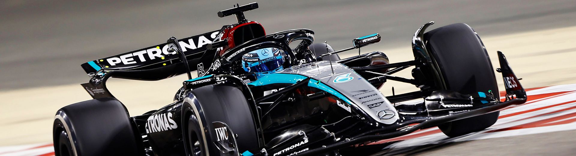 Mercedes-AMG PETRONAS Formula One team race car driving on race track